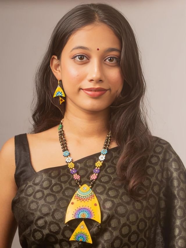 Black Saree with Terracotta Necklace Black Saree with Terracotta Necklace