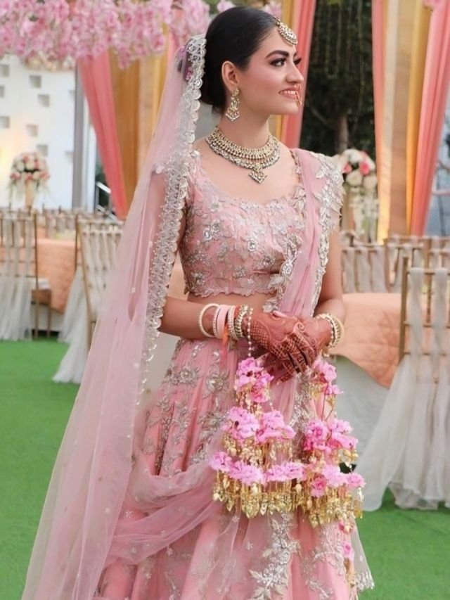 Put Net Dupatta One Side Drape Like Sare and Other Side Pinned on the Bun with Lehenga Put Net Dupatta One Side Drape Like Sare and Other Side Pinned on the Bun with Lehenga