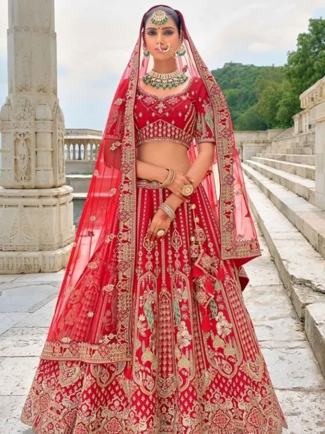 Put Net Dupatta over Head and Keep the One Side Shorter in Length on Lehenga Put Net Dupatta over Head and Keep the One Side Shorter in Length on Lehenga
