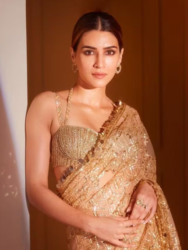 Kriti Sanon in Small Hoop Earrings with Golden Colour Saree Kriti Sanon in Small Hoop Earrings with Golden Colour Saree