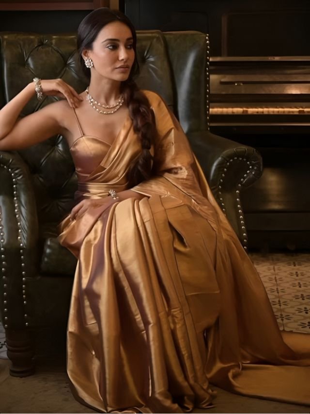 Surbhi Jyoti in Golden Saree with Modern Neckpiece and a Set of Small Earrings and a Sleek Bracelet Surbhi Jyoti in Golden Saree with Modern Neckpiece and a Set of Small Earrings and a Sleek Bracelet