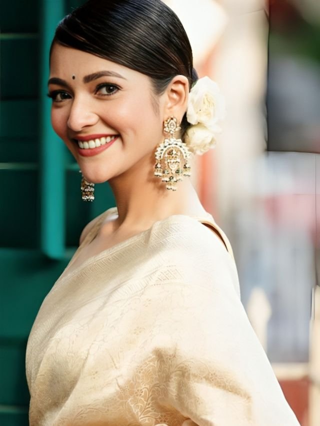 Susmita Chatterjee in Golden Saree with Floral Hairstyle Susmita Chatterjee in Golden Saree with Floral Hairstyle