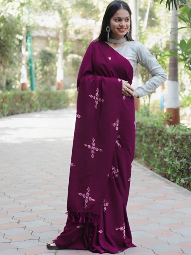 Women Wearing Wine Saree with off white Blouse