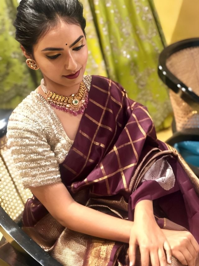 Women in Wine Saree with Beige Blouse