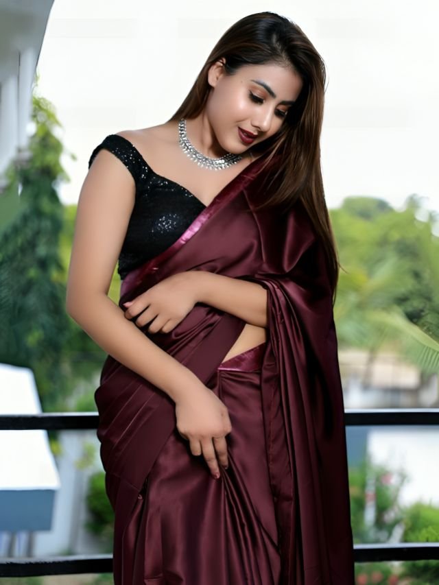 Women in Wine Saree with Black Blouse