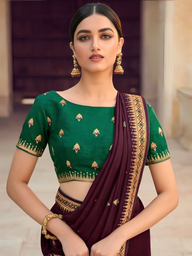 Women in Wine Saree with Emerald Green Blouse