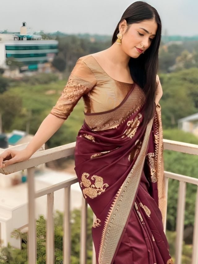 Women in Wine Saree with Gold Blouse